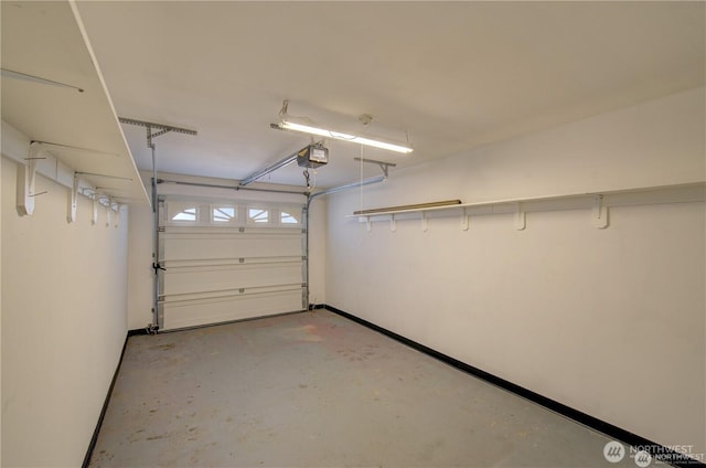 garage featuring baseboards and a garage door opener