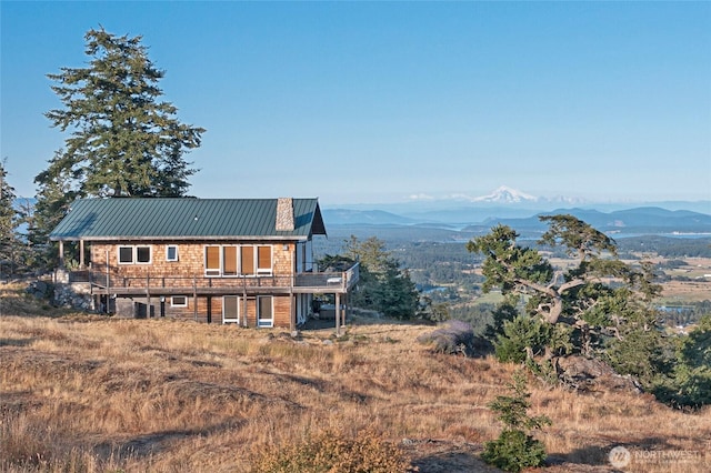 312 Stormridge Rd, Friday Harbor, WA 98250 - rear view of property featuring a deck with mountain view and metal roof