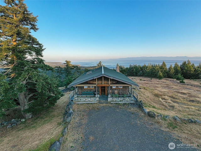 312 Stormridge Rd, Friday Harbor, WA 98250 - view of front of property featuring covered porch and a chimney