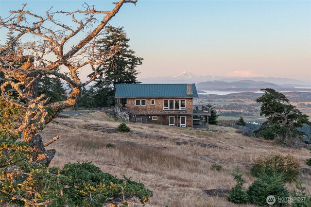312 Stormridge Rd, Friday Harbor, WA 98250 - back of property with a mountain view and metal roof