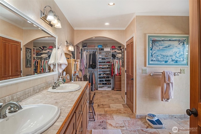 312 Stormridge Rd, Friday Harbor, WA 98250 - full bath featuring double vanity, a sink, stone tile flooring, and crown molding