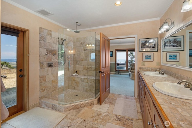 312 Stormridge Rd, Friday Harbor, WA 98250 - full bath with visible vents, a sink, crown molding, and stone tile floors