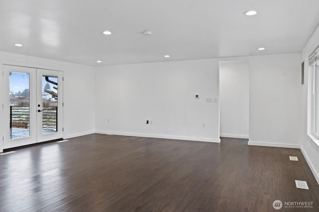 unfurnished room featuring dark wood-style floors, recessed lighting, french doors, and baseboards