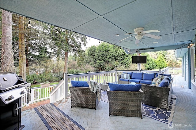 wooden terrace with ceiling fan, outdoor lounge area, and a grill