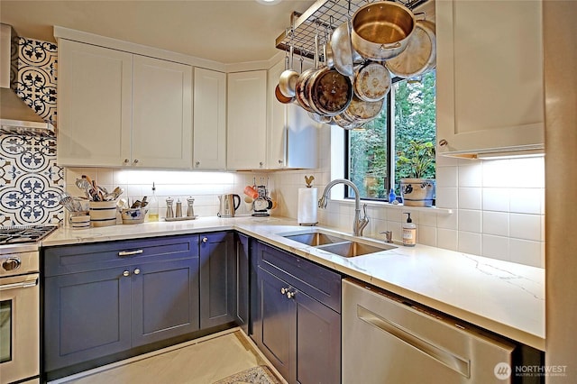 kitchen featuring ventilation hood, a sink, wall oven, and decorative backsplash