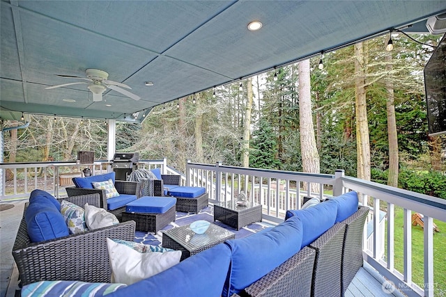 deck featuring grilling area, outdoor lounge area, and a ceiling fan