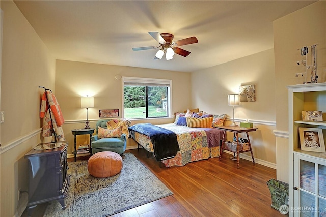 bedroom featuring wood finished floors and a ceiling fan