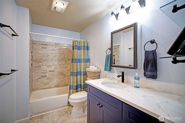 full bathroom with vanity, shower / bath combination with curtain, and toilet