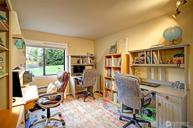 office area with wood finished floors