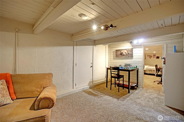 interior space featuring wooden ceiling, beam ceiling, and a textured wall