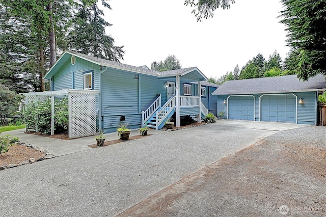 3045 Mabana Heights Rd, Camano Island, WA 98282 - view of front facade featuring a garage and roof with shingles