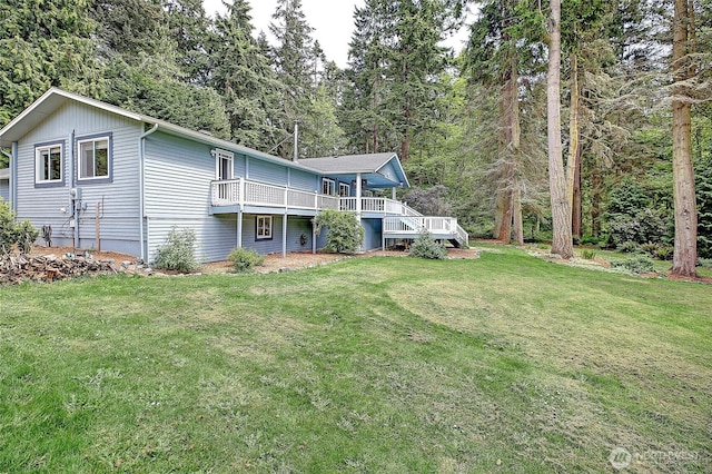3045 Mabana Heights Rd, Camano Island, WA 98282 - rear view of property with a wooden deck, a lawn, and a wooded view