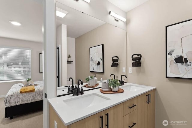 ensuite bathroom featuring double vanity, a sink, and ensuite bathroom