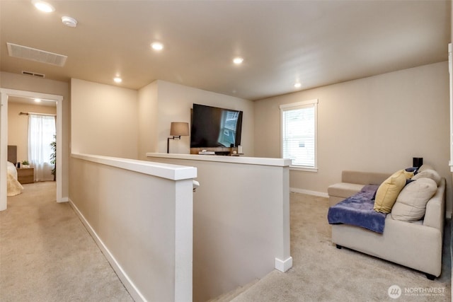 bar with light carpet, plenty of natural light, visible vents, and recessed lighting