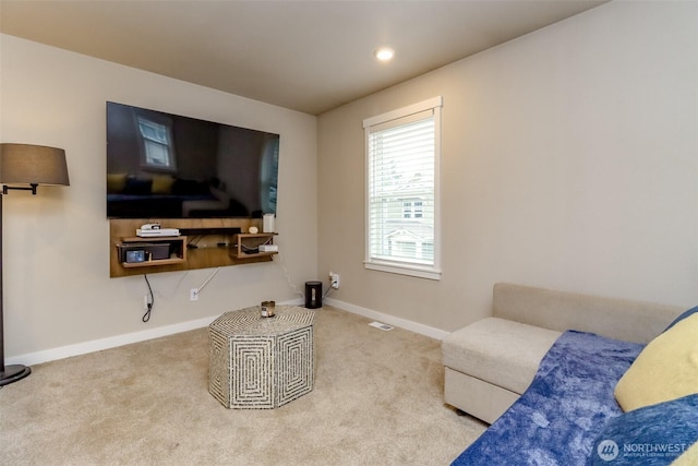 carpeted living room with recessed lighting, visible vents, and baseboards