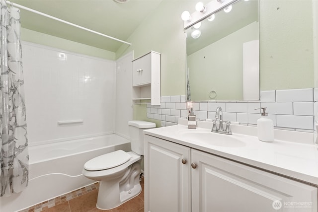 bathroom with tasteful backsplash, toilet, tile patterned floors, shower / bath combination with curtain, and vanity