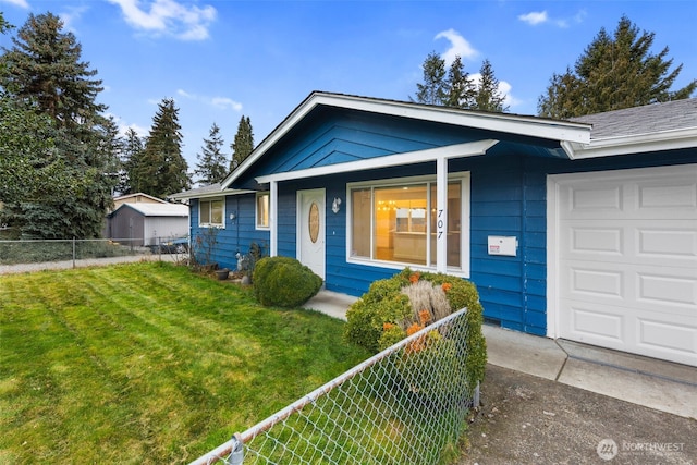 view of front of house featuring a garage, a front yard, and fence