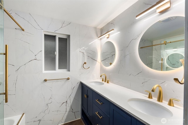 full bathroom with visible vents, a sink, and double vanity