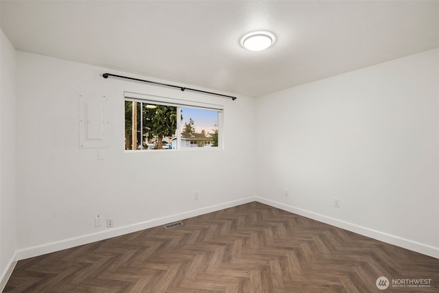 empty room featuring baseboards