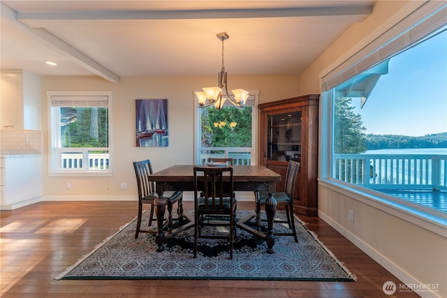 dining space with baseboards, beam ceiling, a chandelier, and dark wood-style flooring