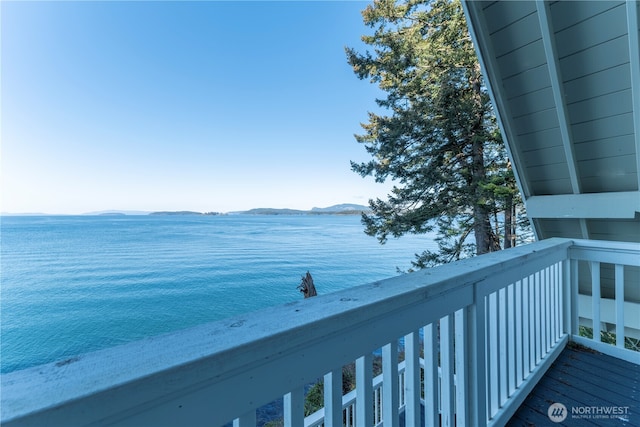 balcony with a water and mountain view