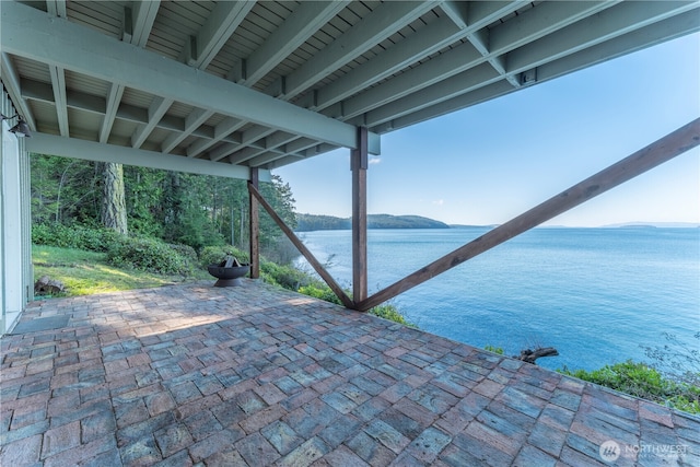 view of patio featuring a water view