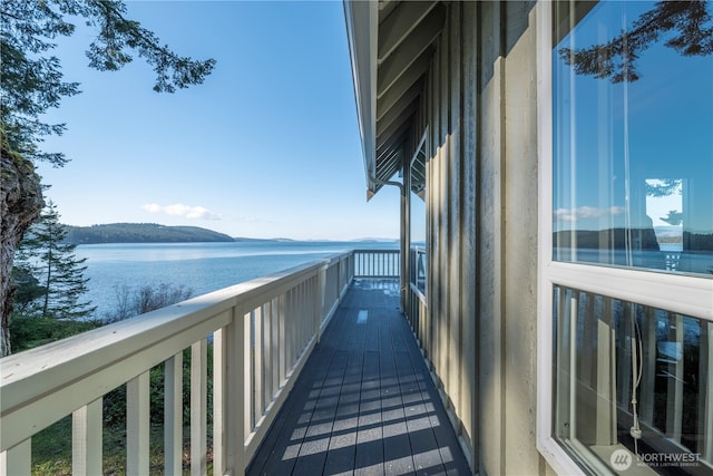 balcony featuring a water view