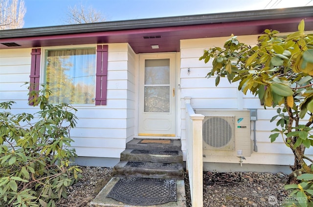 view of exterior entry featuring ac unit