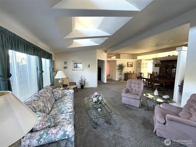 carpeted living area with lofted ceiling