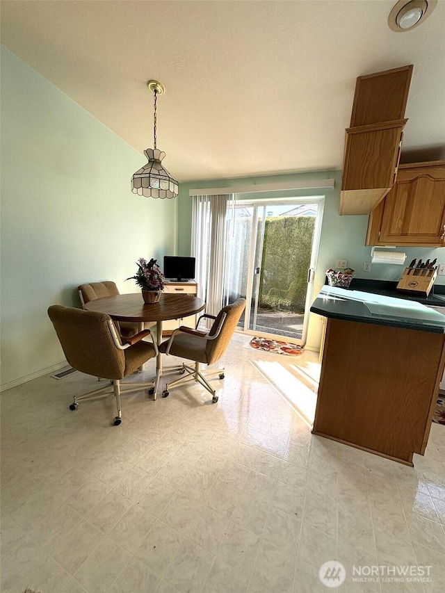 dining area featuring light floors