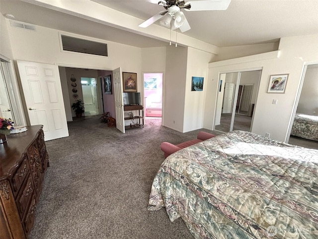 carpeted bedroom with visible vents and ceiling fan