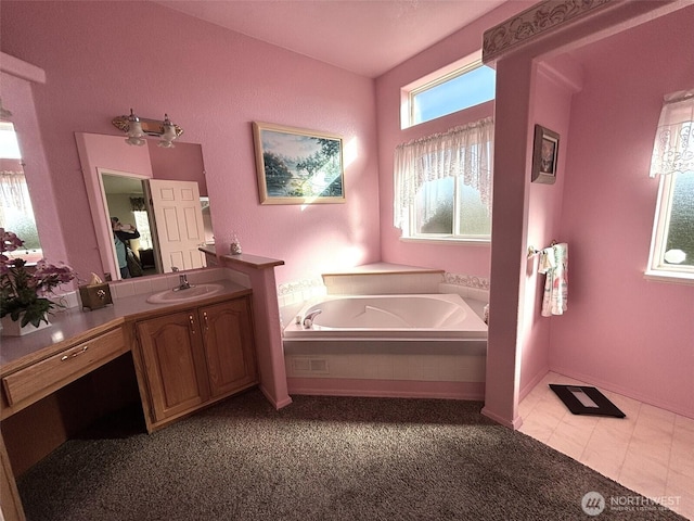 full bathroom with a garden tub and vanity