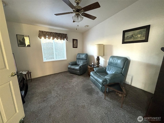 sitting room featuring ceiling fan, lofted ceiling, and carpet floors