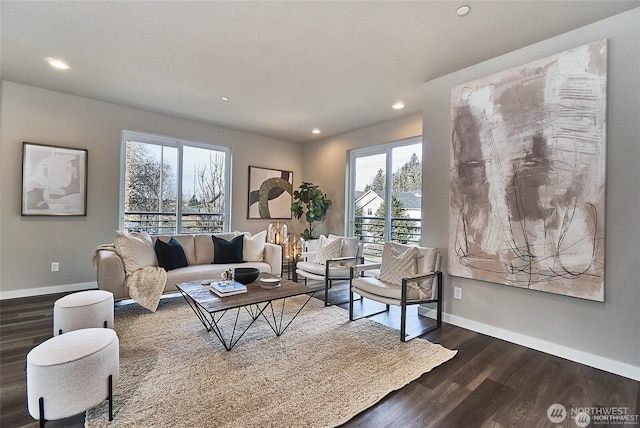 living room featuring recessed lighting, dark wood-type flooring, and baseboards