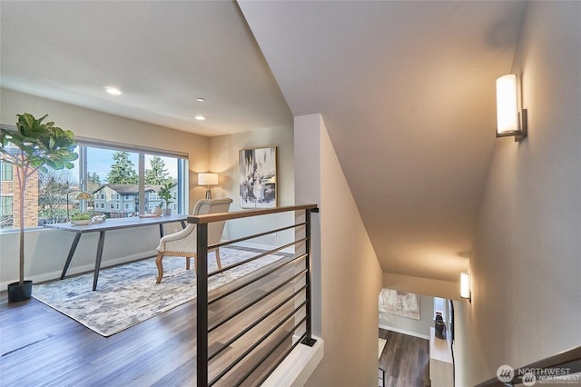 hallway with recessed lighting, baseboards, and wood finished floors