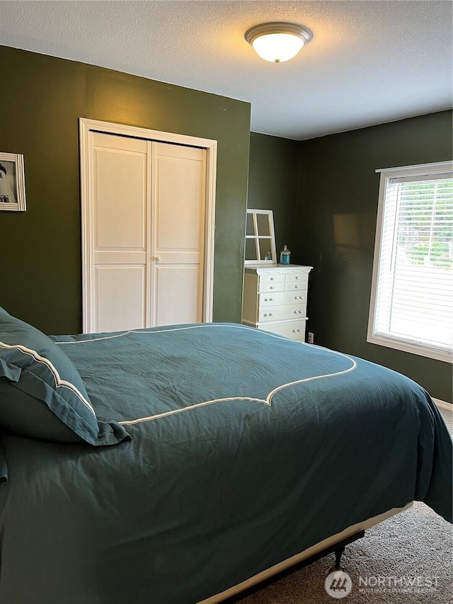 bedroom featuring a closet and a textured ceiling