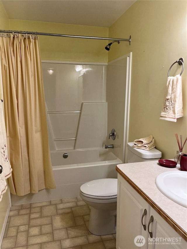 bathroom featuring shower / bathtub combination with curtain, toilet, and vanity