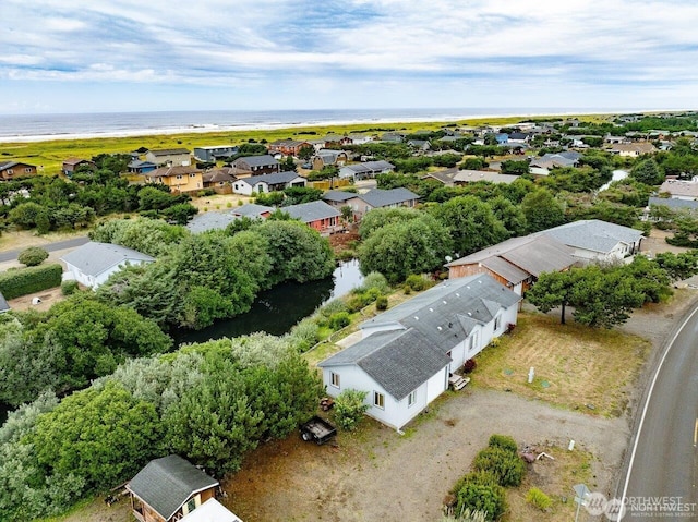 birds eye view of property with a residential view and a water view