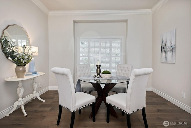 dining area featuring ornamental molding, baseboards, and wood finished floors