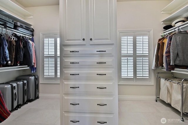 spacious closet featuring tile patterned floors