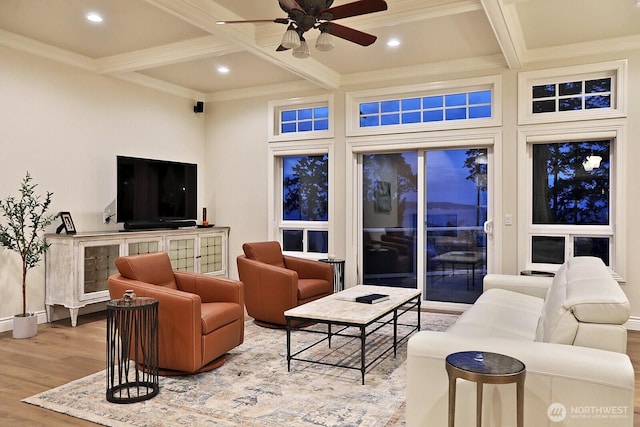 living room featuring wood finished floors, coffered ceiling, a ceiling fan, and beam ceiling