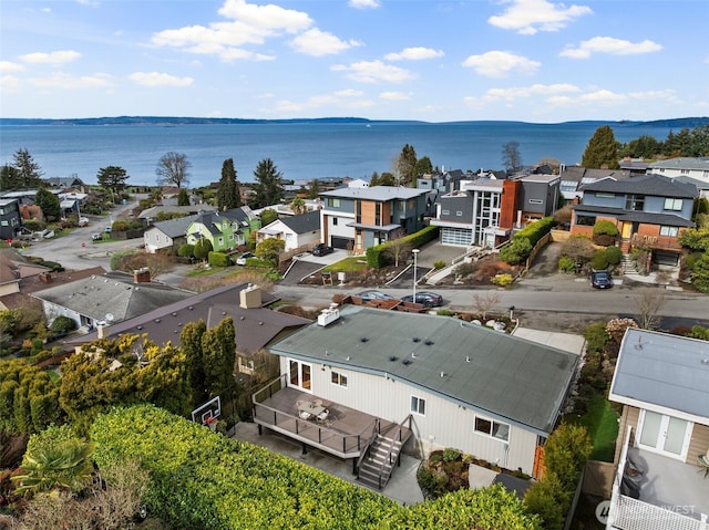 birds eye view of property featuring a water view and a residential view