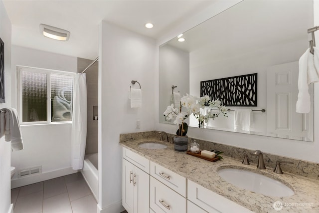 full bath featuring shower / tub combo, tile patterned flooring, visible vents, and a sink