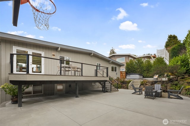 exterior space with stairs and a patio