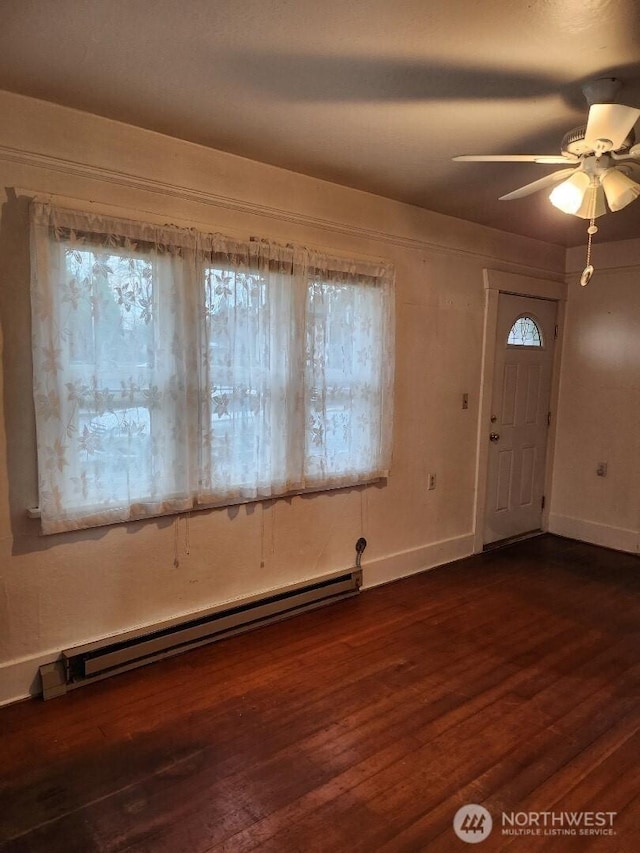 entryway with a baseboard radiator, dark wood-style flooring, ceiling fan, and baseboards