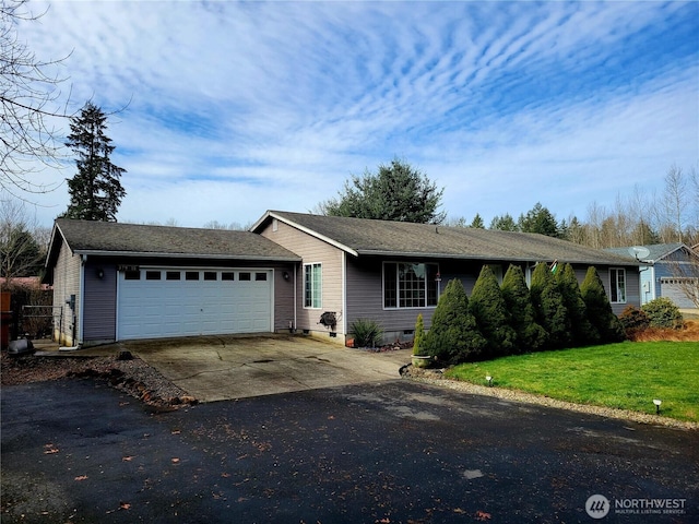 single story home featuring crawl space, an attached garage, concrete driveway, and a front yard