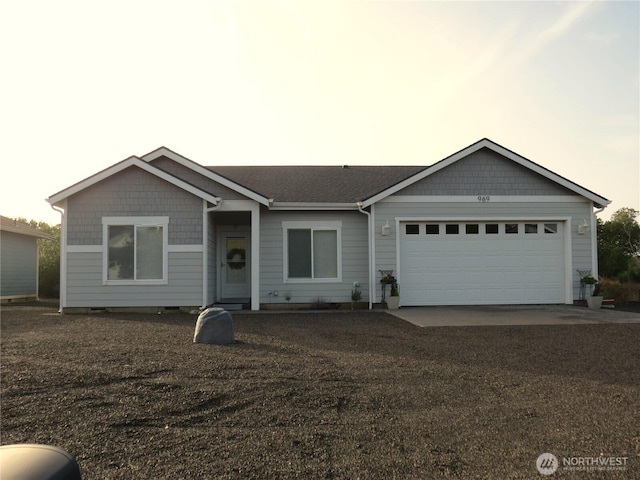 single story home with an attached garage and dirt driveway