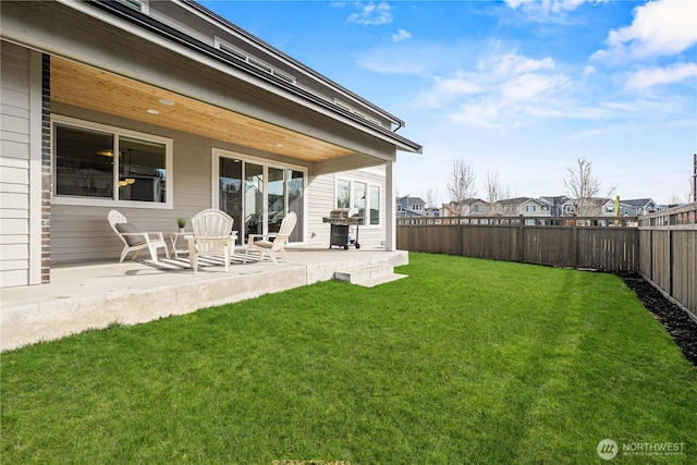 exterior space featuring a yard, a patio area, and a fenced backyard