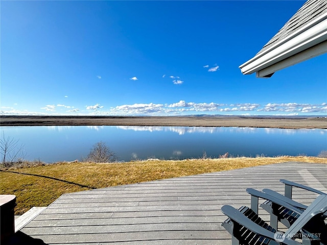 dock area featuring a deck with water view