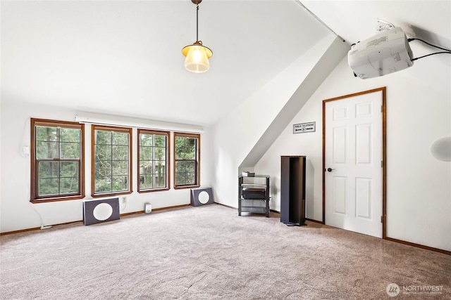 additional living space featuring carpet flooring and baseboards